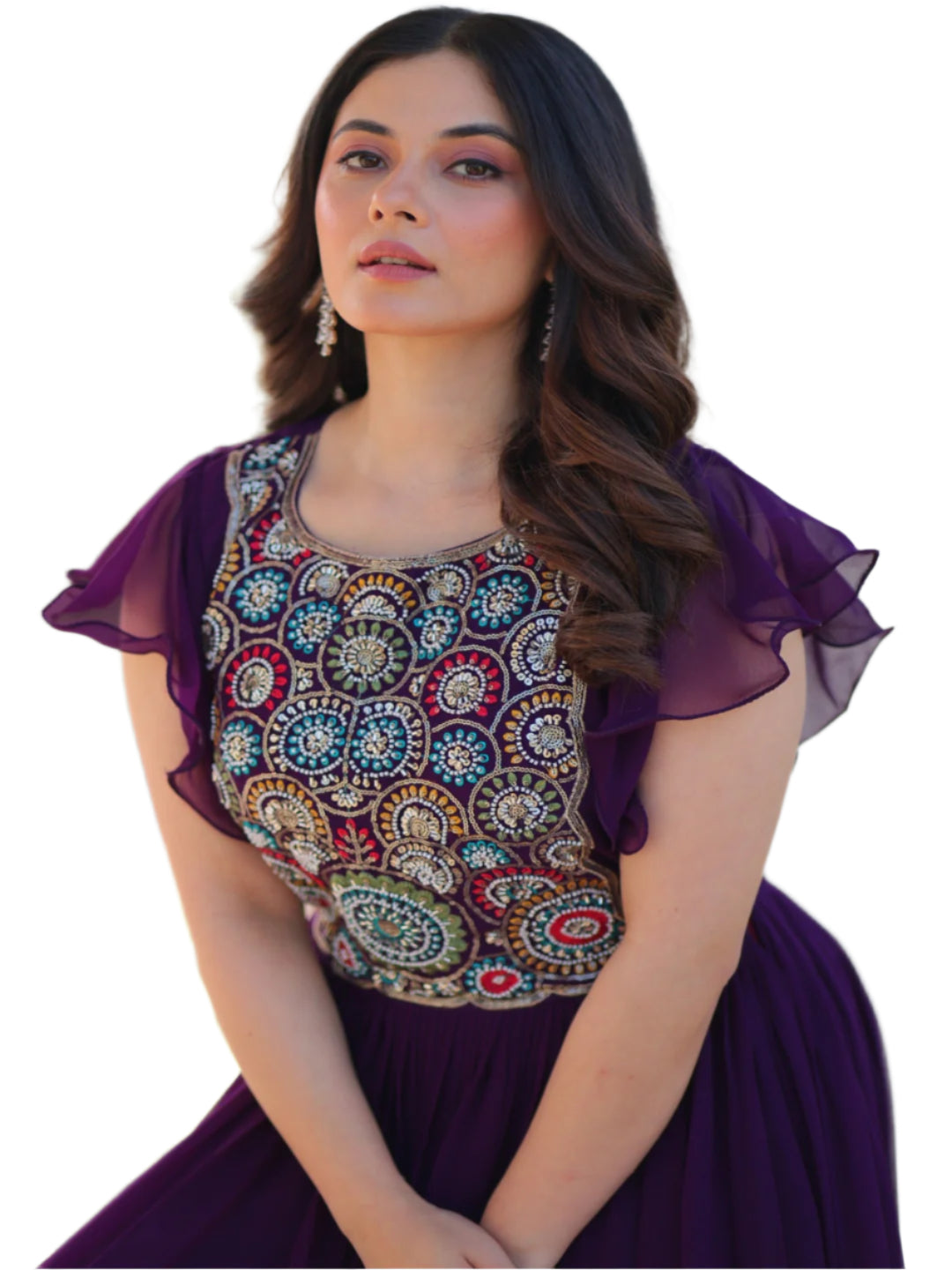 Woman wearing a purple dress with intricate patterns outdoors