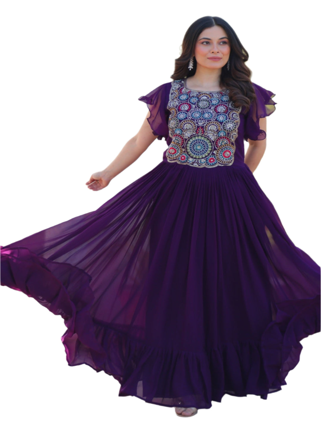 Woman in a purple traditional outfit with floral patterns standing outdoors.