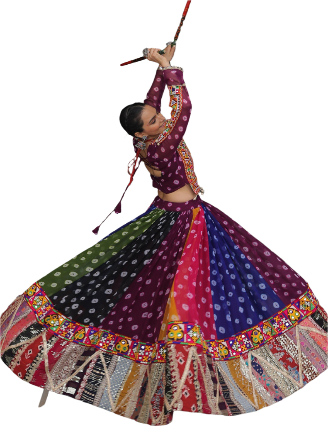 Dancer in a colorful traditional outfit performing in an archway.