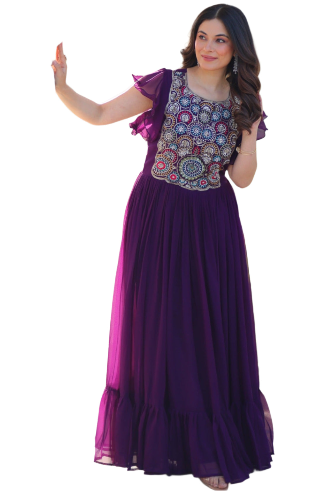 Woman in a purple dress standing in front of a decorative archway.