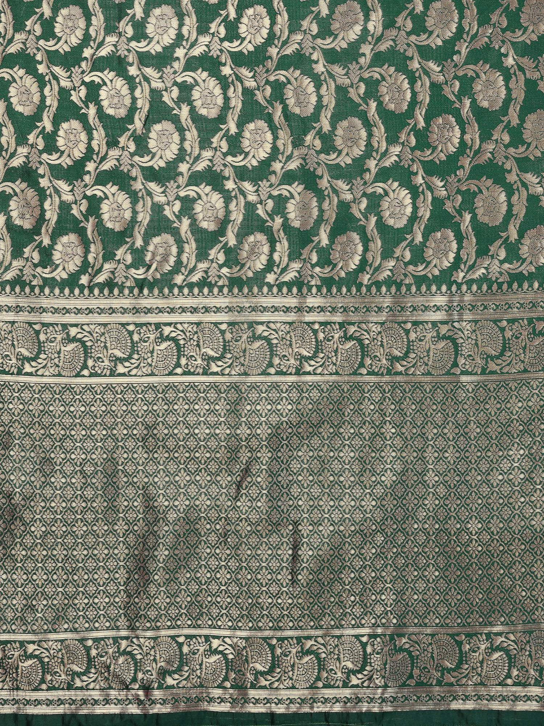 Green fabric with intricate white floral patterns