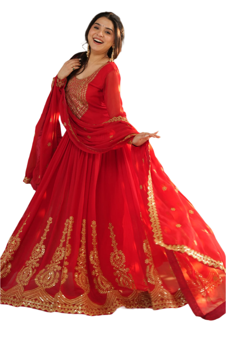 Woman in a red traditional outfit with gold embroidery standing indoors.