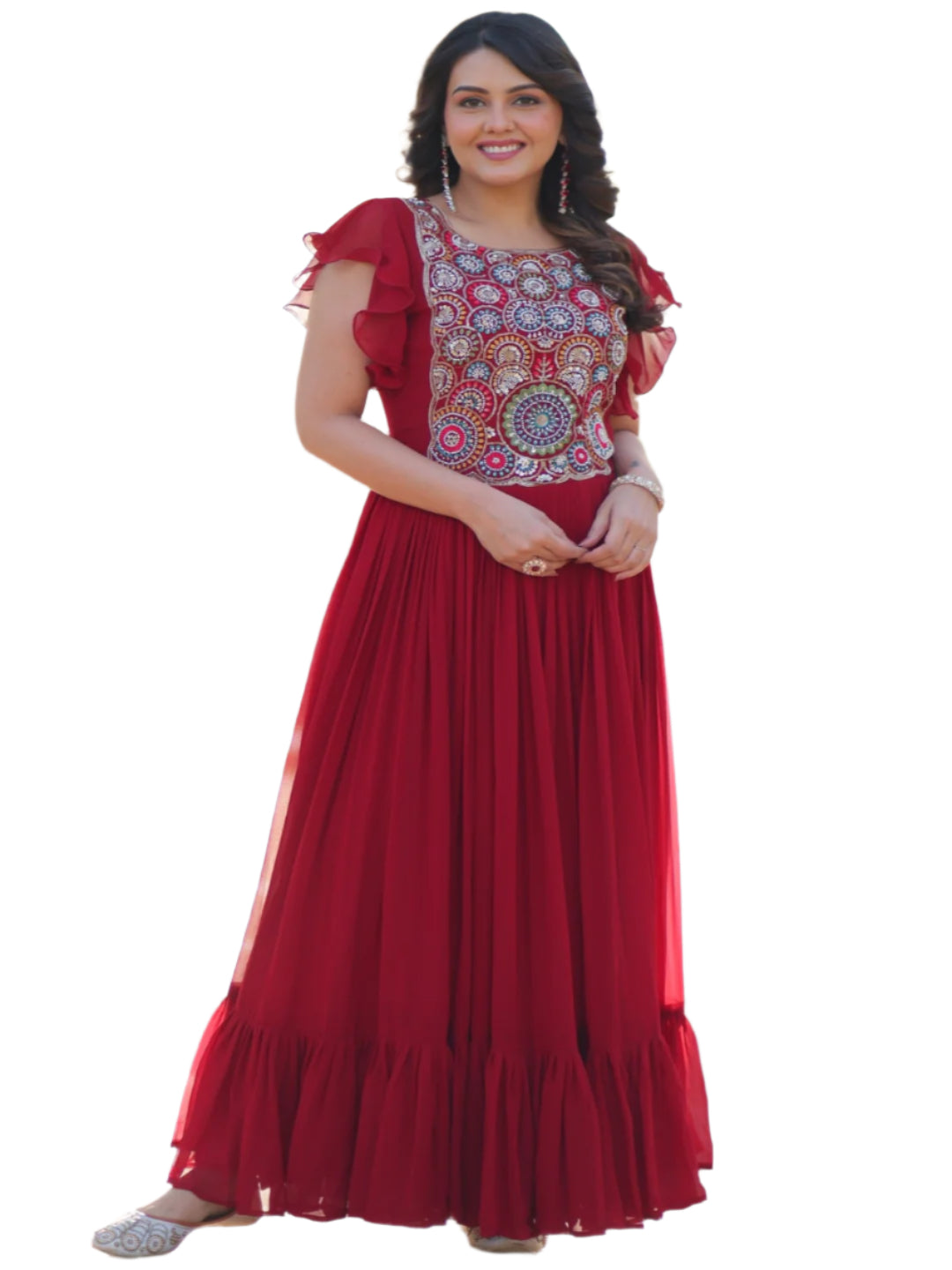 Woman in a red traditional outfit standing in front of an ornate archway.