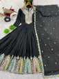 Black embroidered dress with colorful patterns on a light gray background