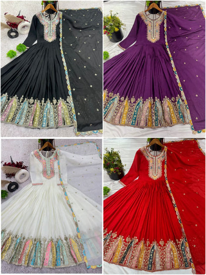Four dresses in black, purple, white, and red with colorful embroidery on a white background.