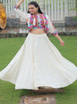 Woman in traditional outfit dancing in a garden setting