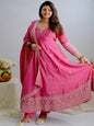 Woman in a pink traditional outfit with a white background