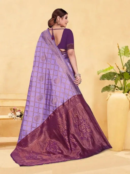 Woman wearing a purple saree with a checkered pattern on a beige background