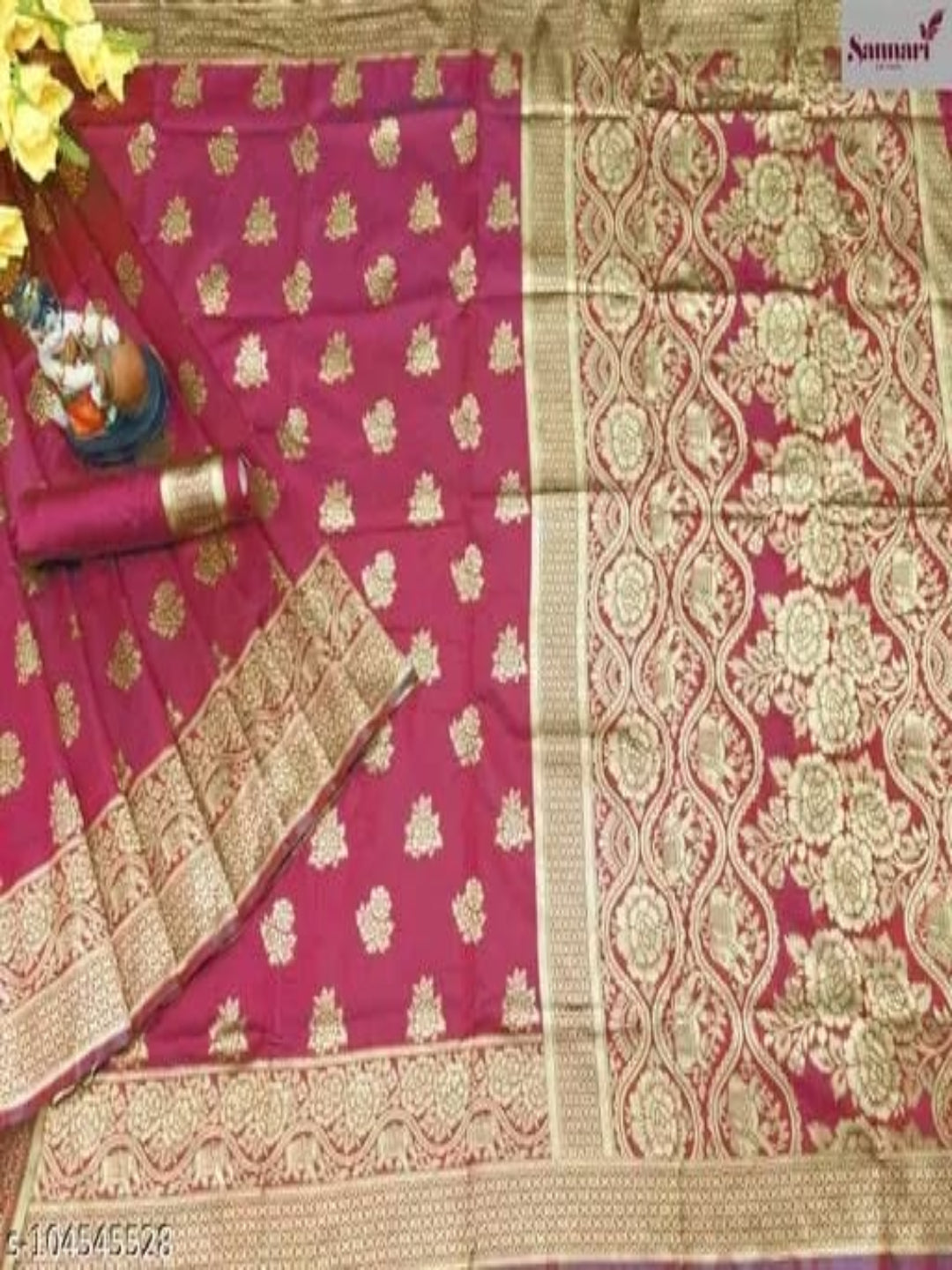 Pink saree with gold patterns and a decorative border