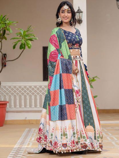 Woman wearing a colorful traditional outfit with a patterned design indoors.