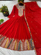 Red embroidered traditional outfit on a white background