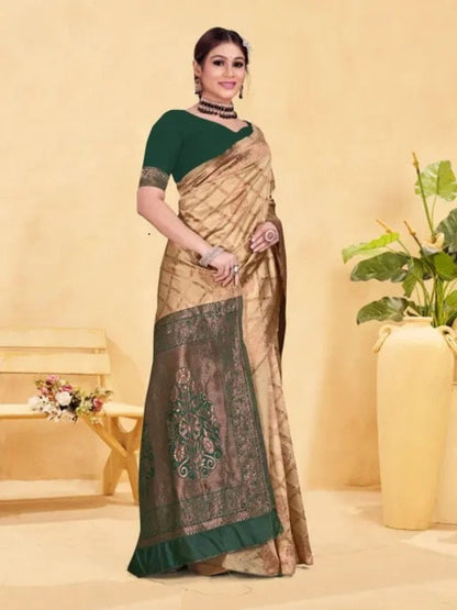 Woman wearing a traditional saree with a green blouse against a beige background