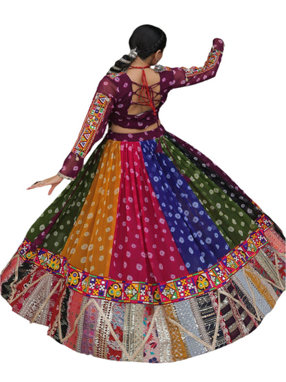 Person wearing a colorful traditional outfit standing in an archway.
