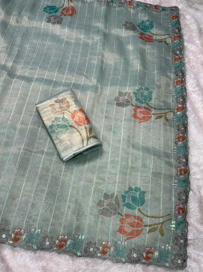 वाईएनएफ काइशा बेज ग्लास टिशू ऑर्गेंज़ा साड़ी, सीक्विन और मल्टी-कलर थ्रेड वर्क के साथ